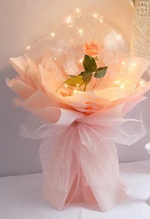 Clear transparent bubble with pink rose pink wrapping
