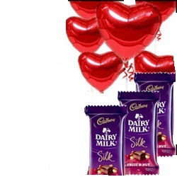 6 Red Heart air filled balloons with 3 Silk chocolates