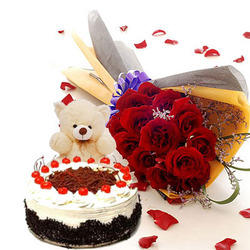 12 red roses with 6 inch Teddy and Half Kg black forest cake