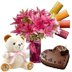 6 lilies vase, 4 temptation chocolates, 1/2 kg Cake,  6 inch teddy