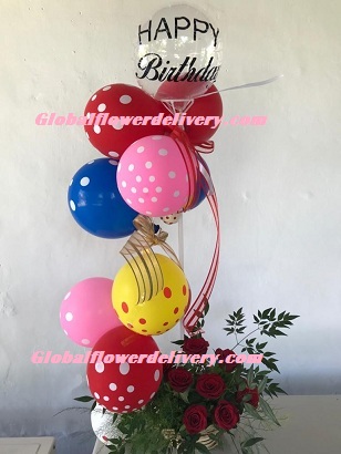 Polka dot air balloons arrangement with roses and happy birthday balloon
