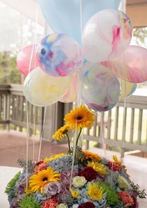 Basket of yellow whitemix 50 flowers with 10 mix balloons cluster on top with leaves