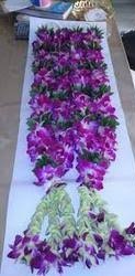A pair of orchid garlands