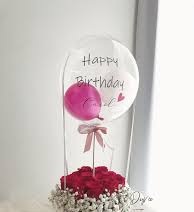 15 Red roses basket with single pink air balloon inside a Printed Happy Birthday transparent Balloon