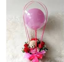 6 Red rose Teddy in basket with single pink air balloon inside a transparent Balloon
